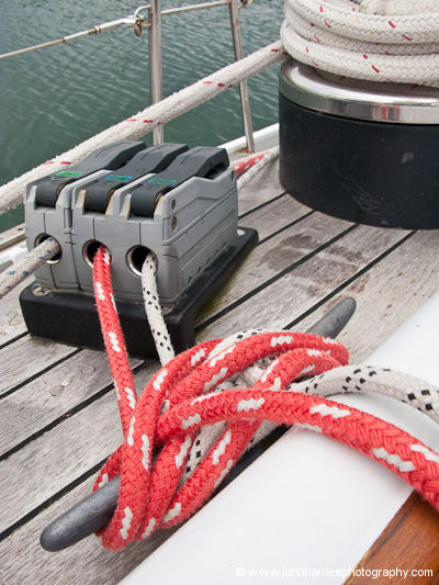 Roller furling lines are run through clutches and then cleated off when expecting a gale or storm on aluminum expedition sailboat Morgan's Cloud