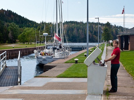 The lock keeper closes the gates on Morgan's Cloud at the St Peters Canal, Cape Breton JHH5II-12704