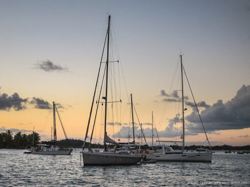 Sailboats at anchor Different types of boat lie in different ways- the narrow tidal anchorage at Sapinho, Baia de Camamu, Brazil.