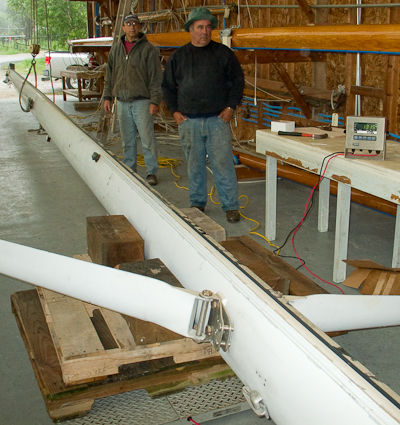 Weighing sailboat Morgan's Cloud's 75' aluminum mast using a blueberry scale at Billings Diesel & Marine