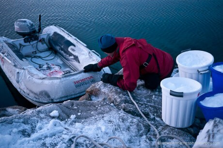 Loading snow to be melted for water into the dinghy