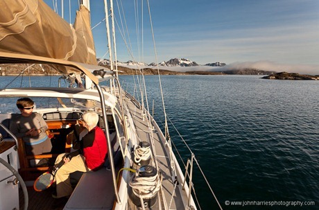 Phyllis and Shelly in the cockpit of Morgan's Cloud in a West Greenland anchorage. JHH5II-10393