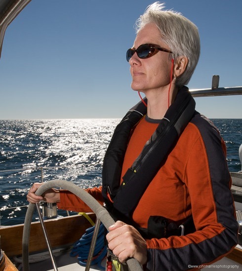 Phyllis Nickel at the helm of "Morgan's Cloud" during a sunny windy afternoon sail off Jonesport, Maine. Phyllis Nickel at the helm of "Morgan's Cloud" during a sunny windy afternoon sail off Jonesport, Maine.