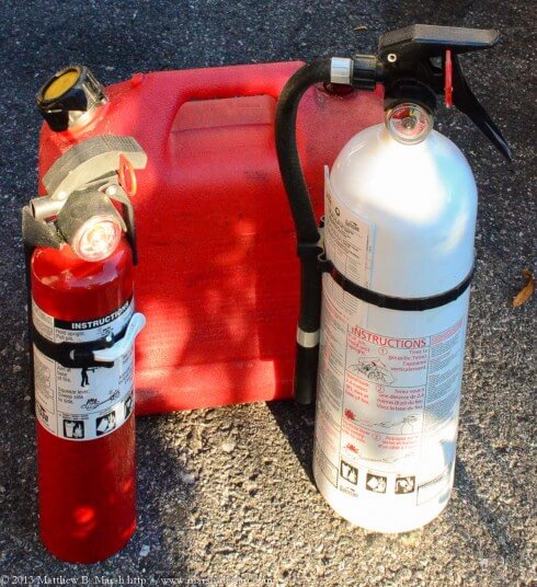 A gas tank with two fire extinguishers MBM20130916-180051-4157w